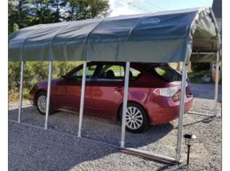 a Rock Solid Shelters canopy model keeping you and your vehicle covered